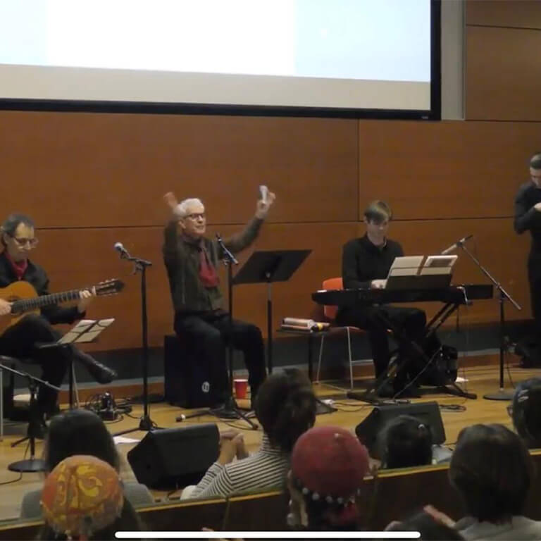 A group of people playing instruments.